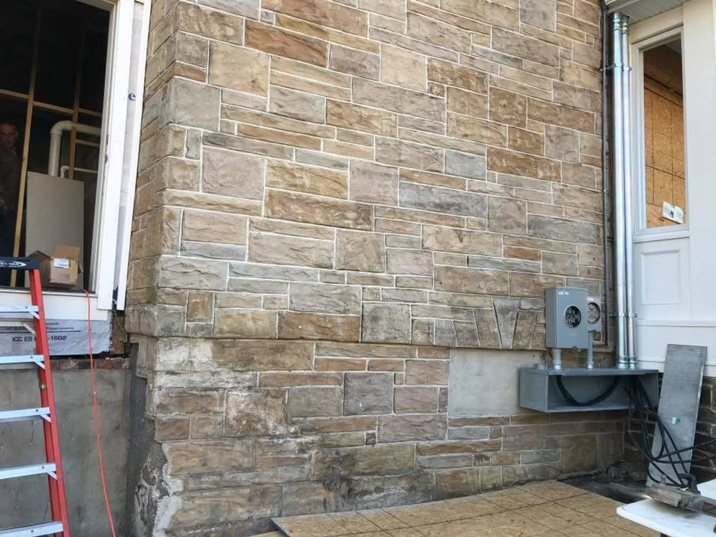 Exterior meter base installation on new construction