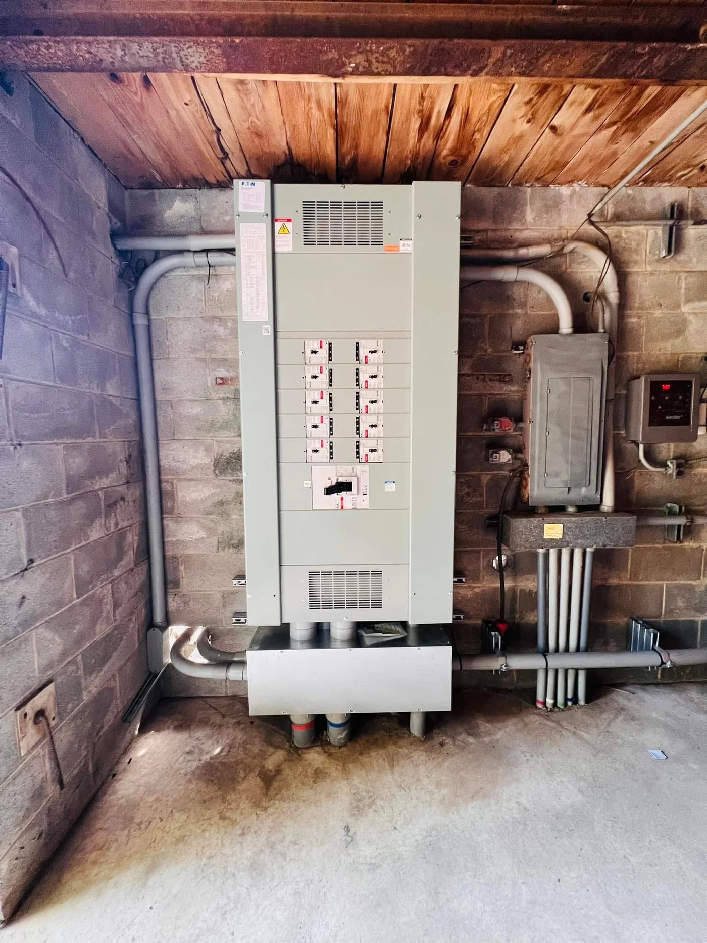 Completed commercial panel installation — Eaton breaker board